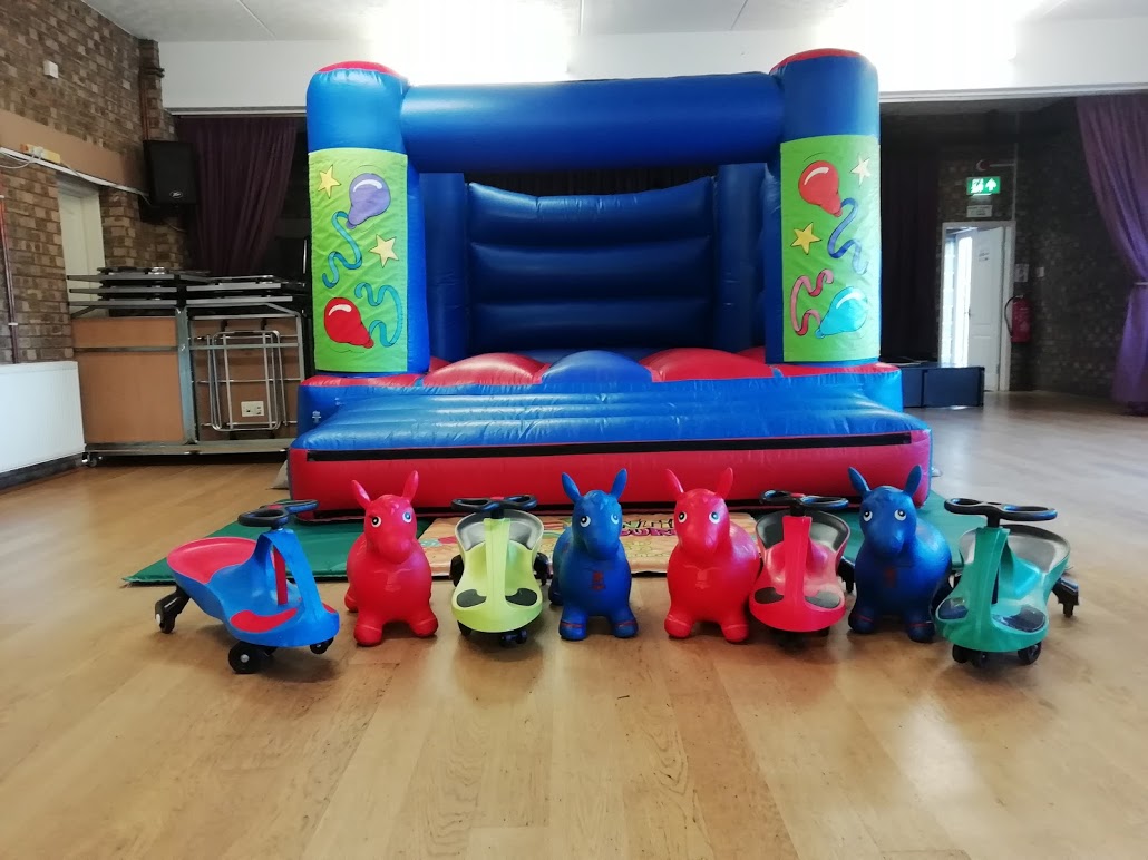 Bouncy Castle And Didy cars at Pinchbeck Village Hall